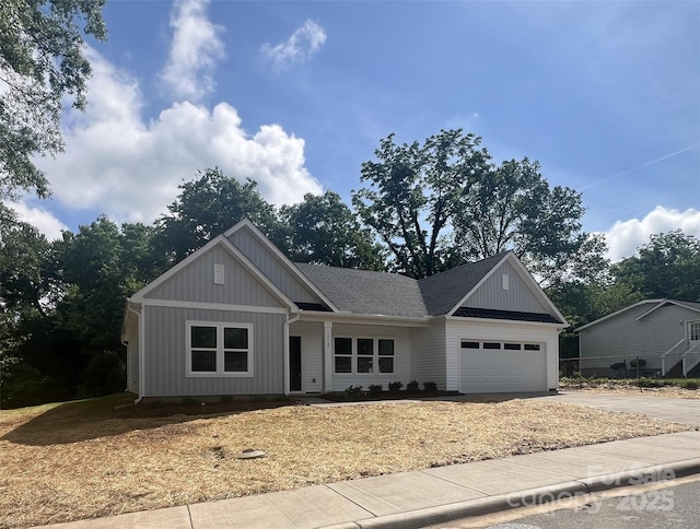 1312 W Monroe Rd, Salisbury, NC 28144 - view of front of house featuring an attached garage, driveway, and board and batten siding