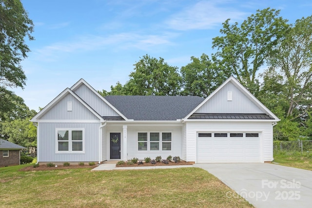 1312 W Monroe Rd, Salisbury, NC 28144 - modern farmhouse style home with a standing seam roof, a garage, concrete driveway, a metal roof, and board and batten siding