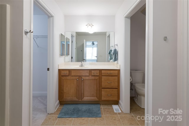 55 Outlook Cir, Swannanoa, NC 28778 - bathroom with toilet, vanity, tile patterned floors, and baseboards