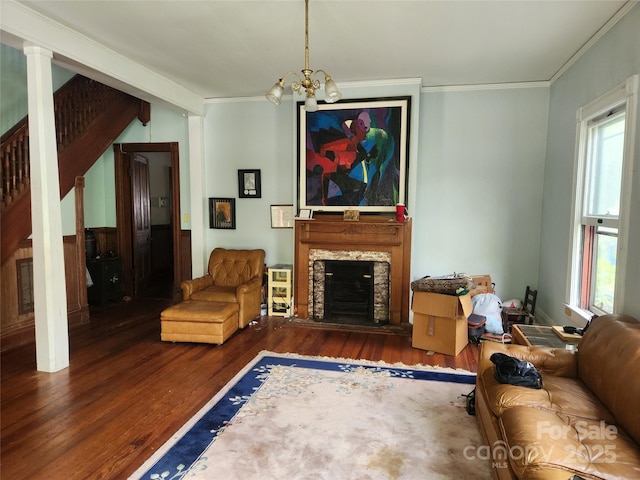 425 W Horah St, Salisbury, NC 28144 - living room with wood finished floors, crown molding, a chandelier, and a stone fireplace