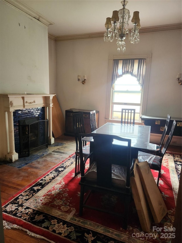 425 W Horah St, Salisbury, NC 28144 - dining room featuring a chandelier, wood finished floors, crown molding, and a tiled fireplace