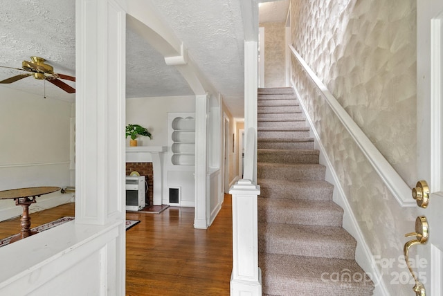 113 4th St, Black Mountain, NC 28711 - stairway with a ceiling fan and wood finished floors
