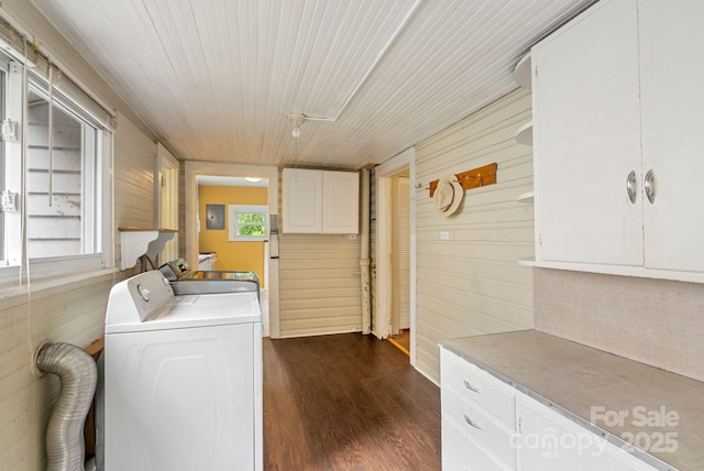 113 4th St, Black Mountain, NC 28711 - washroom featuring wood walls, dark wood-style floors, and washing machine and dryer