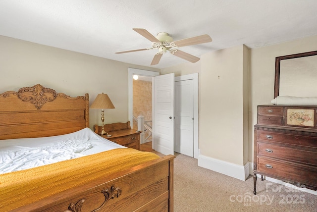 113 4th St, Black Mountain, NC 28711 - bedroom with light colored carpet, a closet, a ceiling fan, and baseboards
