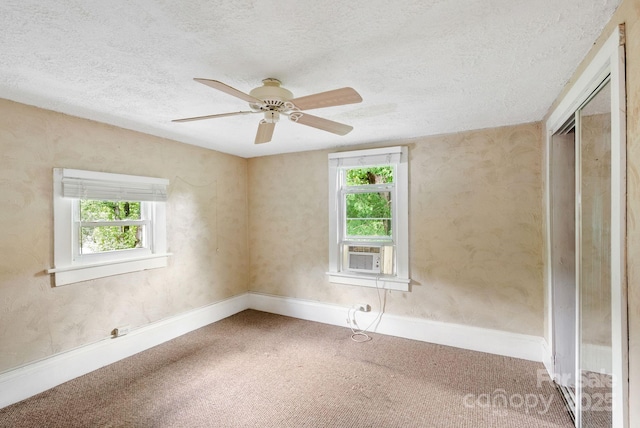 113 4th St, Black Mountain, NC 28711 - carpeted empty room with a textured ceiling, a ceiling fan, cooling unit, and baseboards