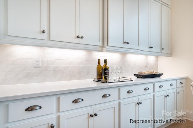 1059 Sage Pine Cir Unit 56, Clover, SC 29710 - kitchen featuring light countertops, decorative backsplash, and white cabinetry