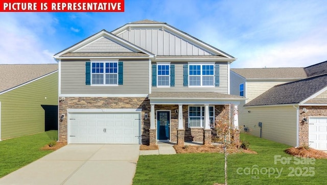 1369 Secrest Commons Dr, Monroe, NC 28112 - craftsman house featuring stone siding, concrete driveway, a front yard, a garage, and board and batten siding
