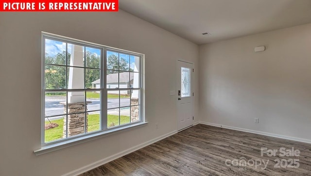1369 Secrest Commons Dr, Monroe, NC 28112 - empty room featuring healthy amount of natural light, wood finished floors, and baseboards