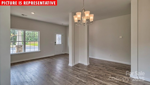 1369 Secrest Commons Dr, Monroe, NC 28112 - empty room with a chandelier, dark wood finished floors, and baseboards
