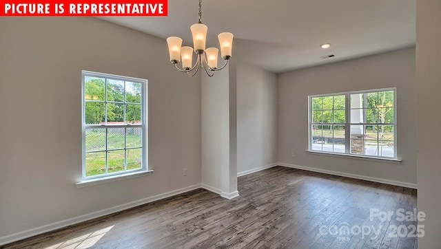 1369 Secrest Commons Dr, Monroe, NC 28112 - unfurnished room with healthy amount of natural light, wood finished floors, and baseboards