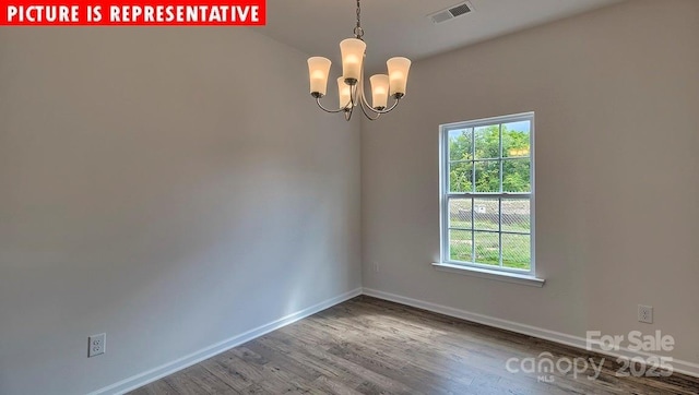 1369 Secrest Commons Dr, Monroe, NC 28112 - spare room with healthy amount of natural light, a chandelier, wood finished floors, and baseboards