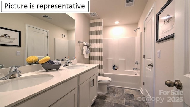 1369 Secrest Commons Dr, Monroe, NC 28112 - full bathroom with toilet, double vanity, shower / tub combo, and stone finish floors