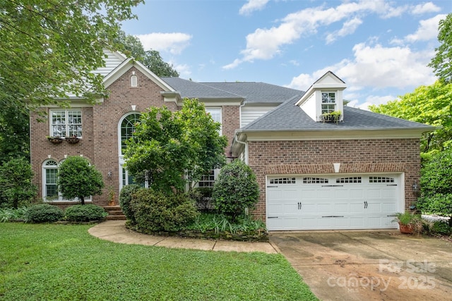8219 Beardsley Dr, Charlotte, NC 28269 - traditional-style house with driveway, a front yard, an attached garage, brick siding, and roof with shingles