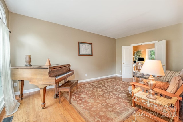 8219 Beardsley Dr, Charlotte, NC 28269 - living area featuring baseboards and light wood-type flooring