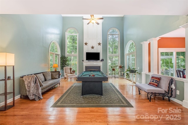 8219 Beardsley Dr, Charlotte, NC 28269 - living area with a towering ceiling, wood finished floors, and baseboards