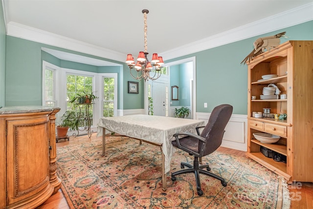 8219 Beardsley Dr, Charlotte, NC 28269 - home office with crown molding, light wood-style flooring, a chandelier, and wainscoting