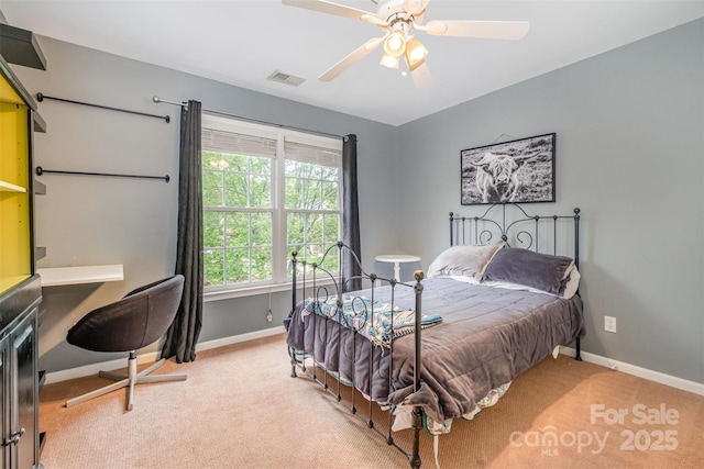 8219 Beardsley Dr, Charlotte, NC 28269 - bedroom featuring light carpet, baseboards, and a ceiling fan