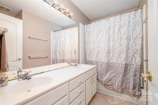 8219 Beardsley Dr, Charlotte, NC 28269 - full bathroom with tile patterned floors and double vanity