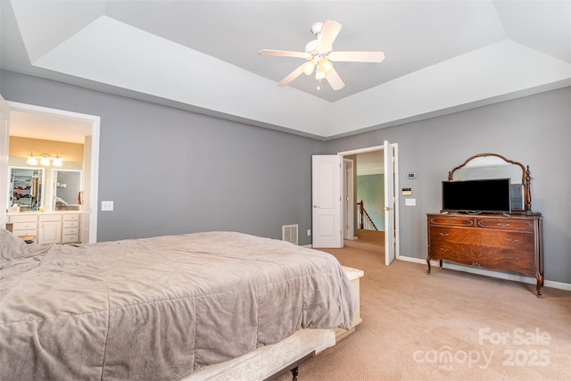 8219 Beardsley Dr, Charlotte, NC 28269 - bedroom with light carpet, a raised ceiling, baseboards, and a ceiling fan