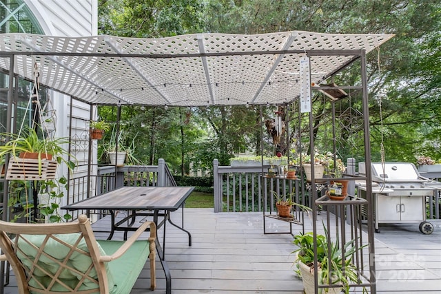 8219 Beardsley Dr, Charlotte, NC 28269 - deck with outdoor dining space, a pergola, and view of scattered trees