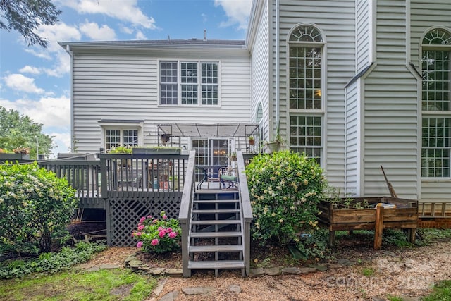 8219 Beardsley Dr, Charlotte, NC 28269 - back of property with a wooden deck, a pergola, and stairs