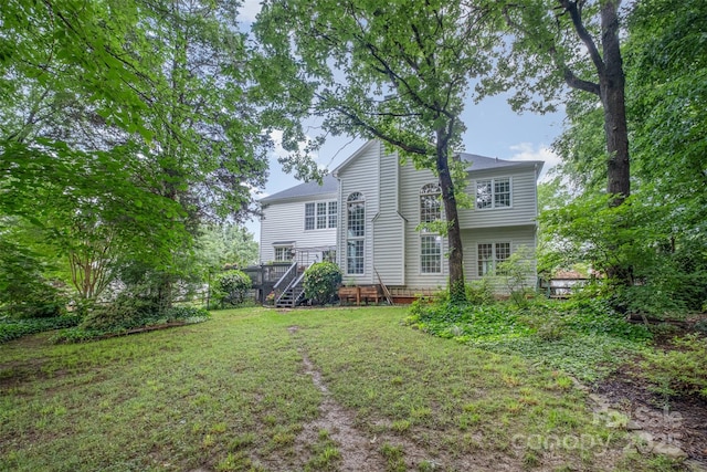 8219 Beardsley Dr, Charlotte, NC 28269 - rear view of house featuring a lawn and stairway