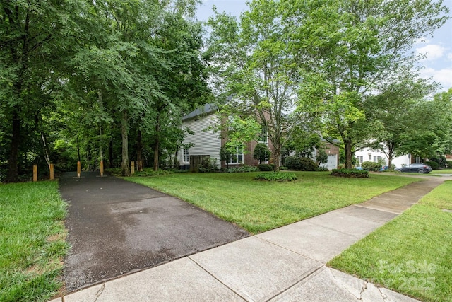 8219 Beardsley Dr, Charlotte, NC 28269 - obstructed view of property featuring a front lawn