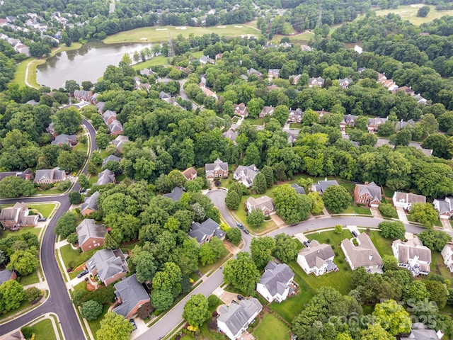 8219 Beardsley Dr, Charlotte, NC 28269 - aerial perspective of suburban area with a nearby body of water
