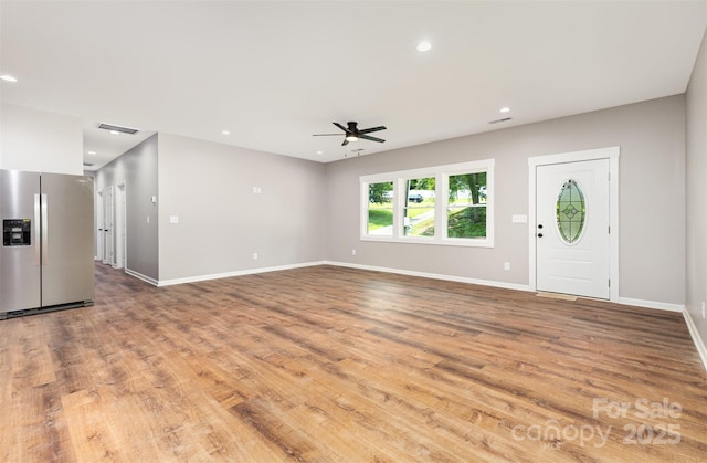 627 W Main Ext, Lincolnton, NC 28092 - unfurnished living room with a ceiling fan, light wood-style flooring, baseboards, and recessed lighting