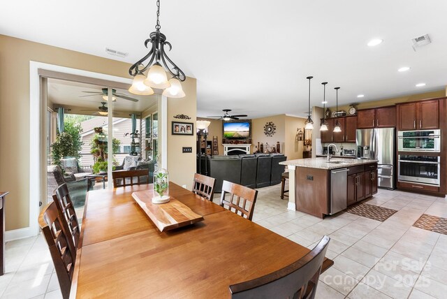 708 Ardent Trl, Belmont, NC 28012 - dining space with a ceiling fan, light tile patterned floors, and recessed lighting