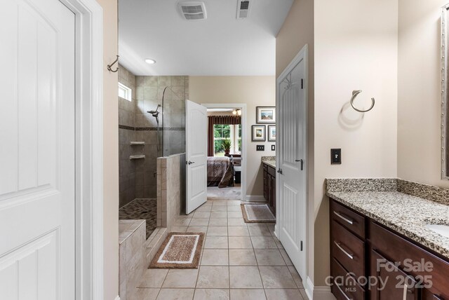 708 Ardent Trl, Belmont, NC 28012 - ensuite bathroom with walk in shower, vanity, tile patterned floors, and baseboards