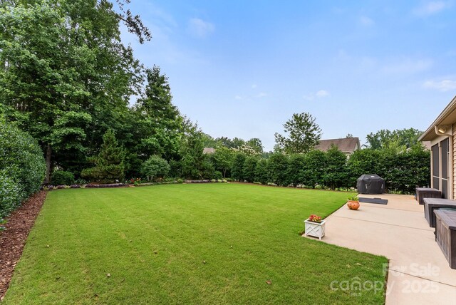708 Ardent Trl, Belmont, NC 28012 - view of grassy yard featuring a patio area