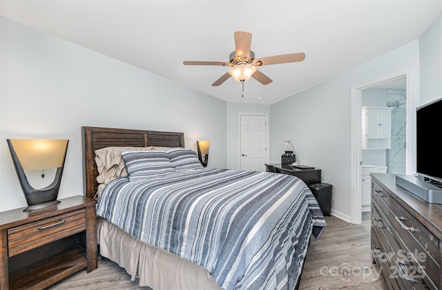 18741 Nautical Dr Unit 205, Cornelius, NC 28031 - bedroom featuring light wood-style flooring, baseboards, ceiling fan, and ensuite bathroom