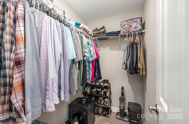 18741 Nautical Dr Unit 205, Cornelius, NC 28031 - walk in closet featuring wood finished floors