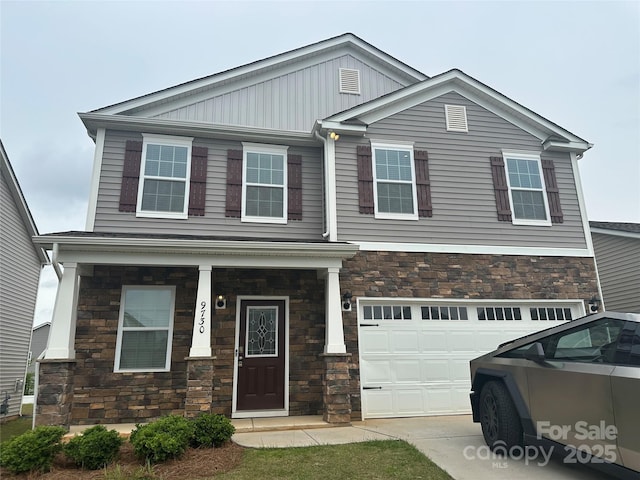 9730 Tea Garden Dr, Gastonia, NC 28056 - view of front facade featuring stone siding, board and batten siding, and a garage