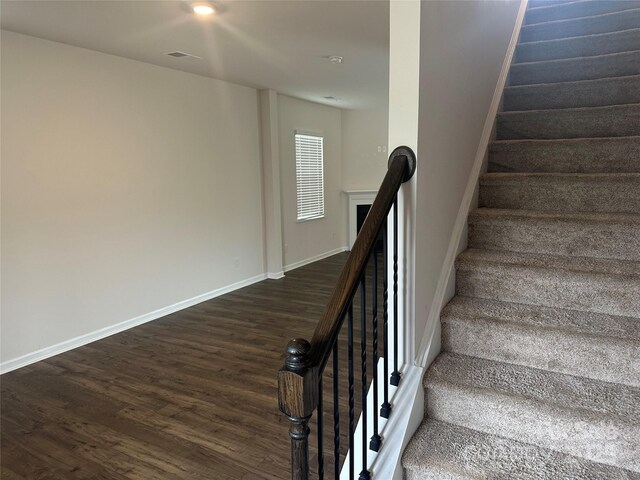 9730 Tea Garden Dr, Gastonia, NC 28056 - stairs featuring wood finished floors and baseboards
