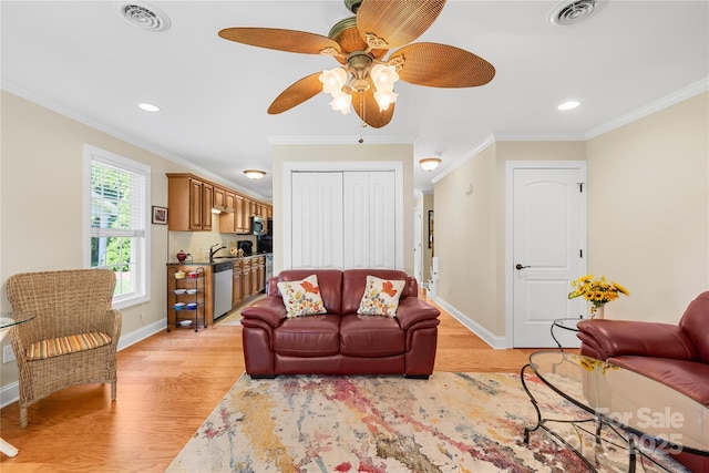 49009 Dockside Ln Unit D, Albemarle, NC 28001 - living room with light wood-style flooring, crown molding, ceiling fan, and recessed lighting