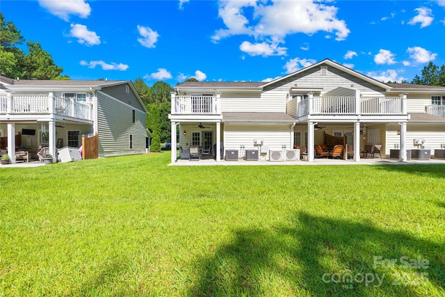 49009 Dockside Ln Unit D, Albemarle, NC 28001 - back of house featuring a balcony, ceiling fan, a yard, and a patio area