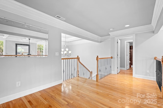 9112 Butterfly Ct, Gastonia, NC 28056 - corridor with an upstairs landing, crown molding, a chandelier, baseboards, and wood finished floors