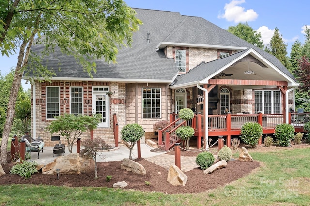 9112 Butterfly Ct, Gastonia, NC 28056 - back of property featuring a deck, ceiling fan, roof with shingles, a patio area, and brick siding