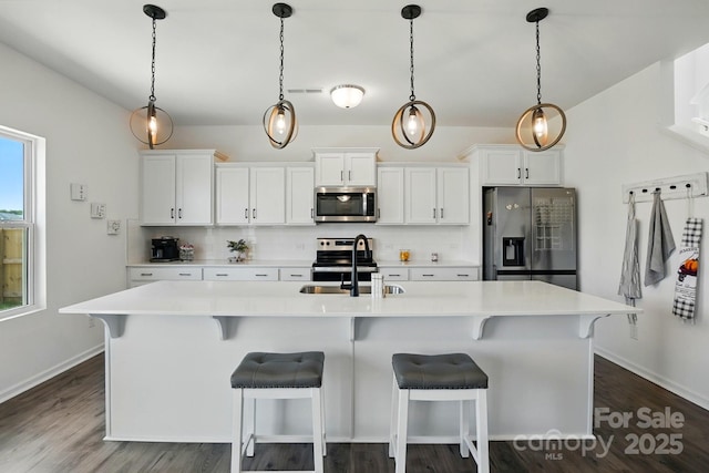 133 Aspire Cir, Wingate, NC 28174 - kitchen featuring stainless steel appliances, a sink, decorative backsplash, and light countertops