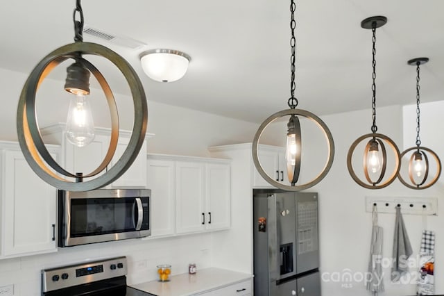 133 Aspire Cir, Wingate, NC 28174 - kitchen view of appliances with stainless steel finishes, tasteful backsplash, white cabinetry, and light countertops
