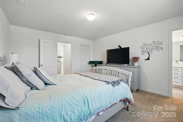 133 Aspire Cir, Wingate, NC 28174 - bedroom with light carpet, baseboards, and ensuite bath