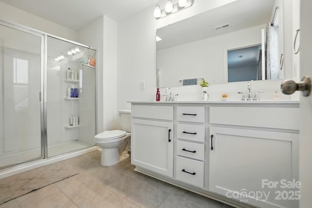 133 Aspire Cir, Wingate, NC 28174 - bathroom featuring a shower stall, tile patterned flooring, double vanity, and toilet