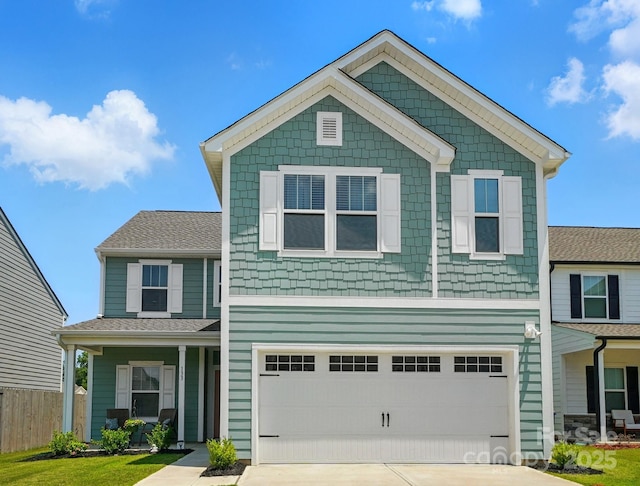 133 Aspire Cir, Wingate, NC 28174 - view of front facade featuring driveway, covered porch, and an attached garage