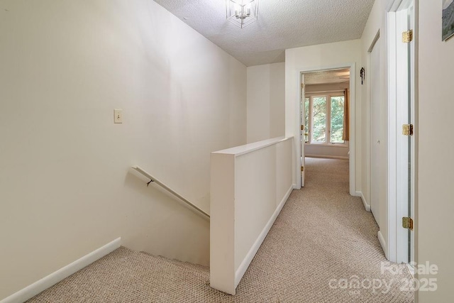 118 Colony Dr, Arden, NC 28704 - hall featuring an upstairs landing, light colored carpet, and a textured ceiling