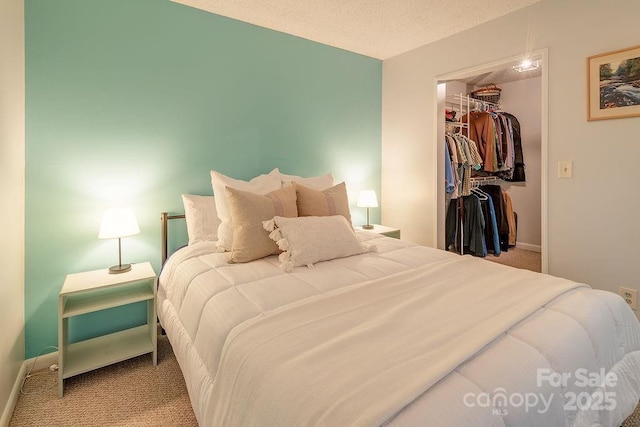 118 Colony Dr, Arden, NC 28704 - carpeted bedroom featuring a walk in closet and a closet