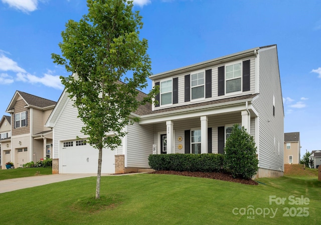 204 Fesperman Cir, Troutman, NC 28166 - view of front facade with driveway, a front lawn, and covered porch
