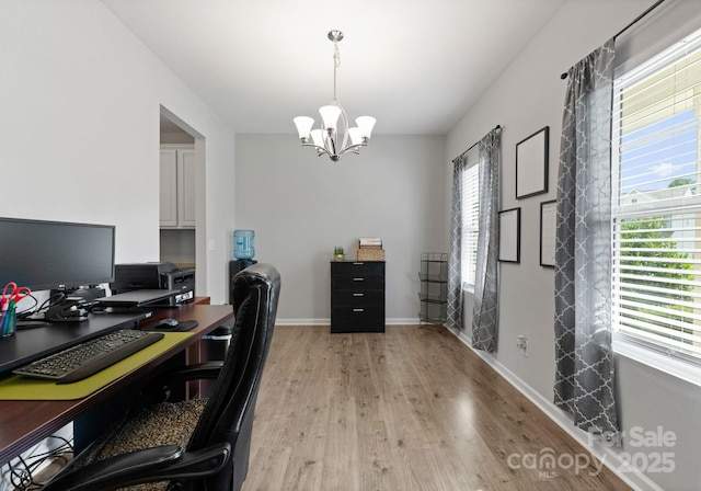 204 Fesperman Cir, Troutman, NC 28166 - office space with a chandelier and light wood-style flooring