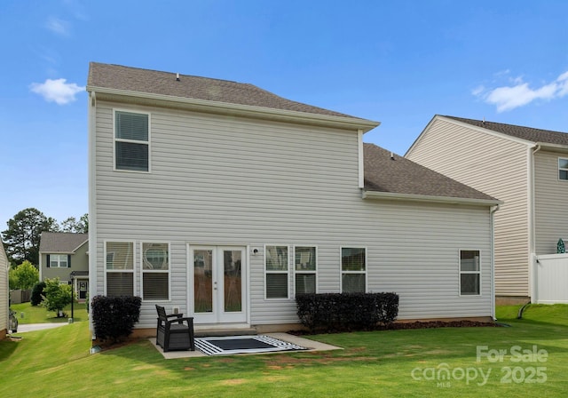 204 Fesperman Cir, Troutman, NC 28166 - back of property featuring a yard, french doors, and a shingled roof
